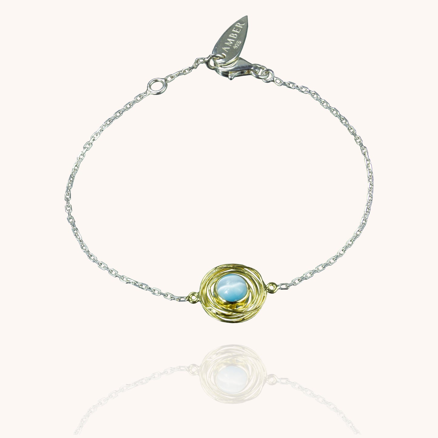 Physis silver and gold bracelet with blue cats eye