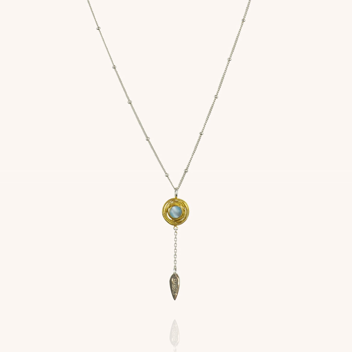 Physis silver necklace with gold vermeil and blue cats eye pendant